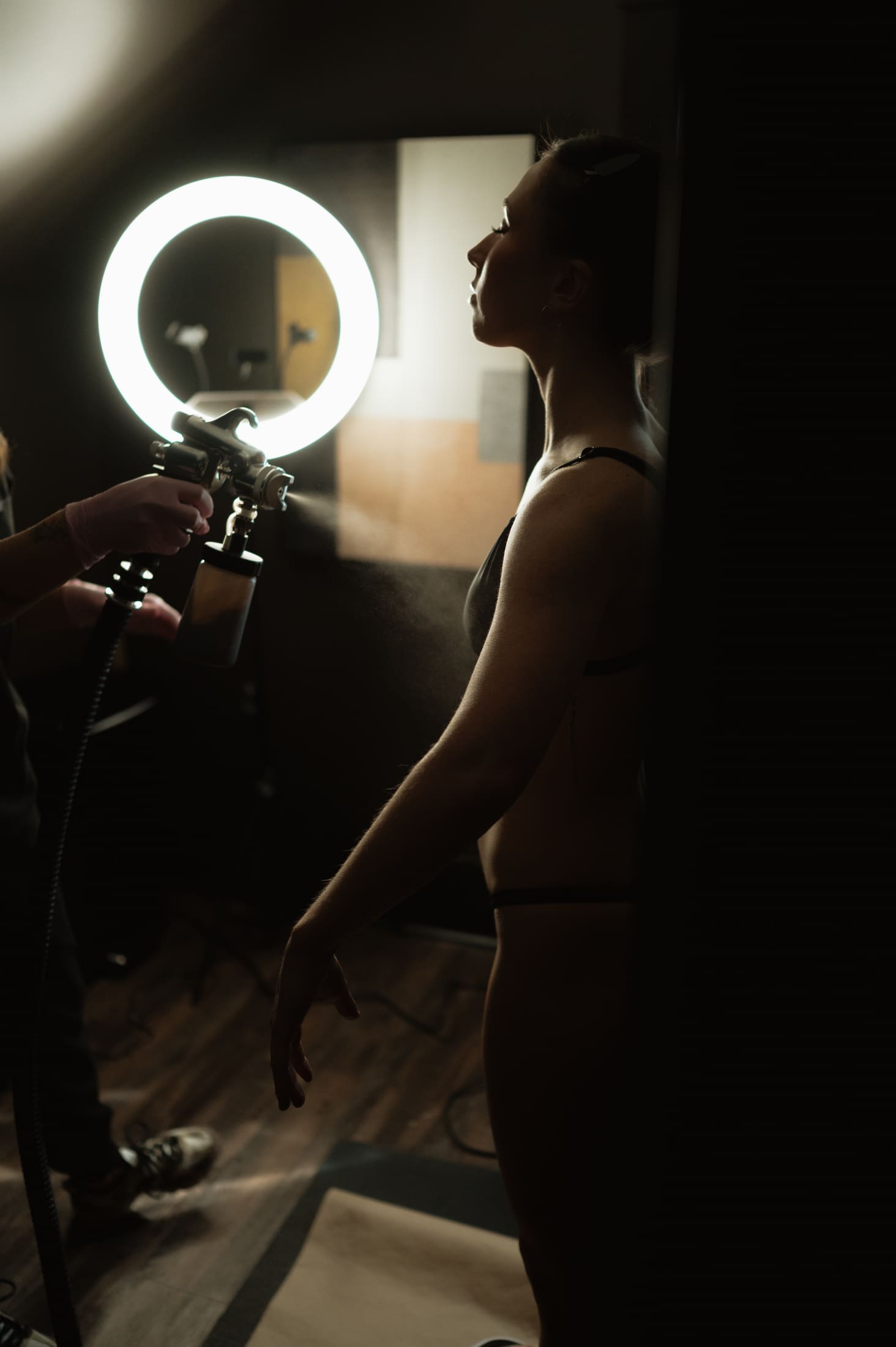 Custom spray tan being applied in the Knoxville studio