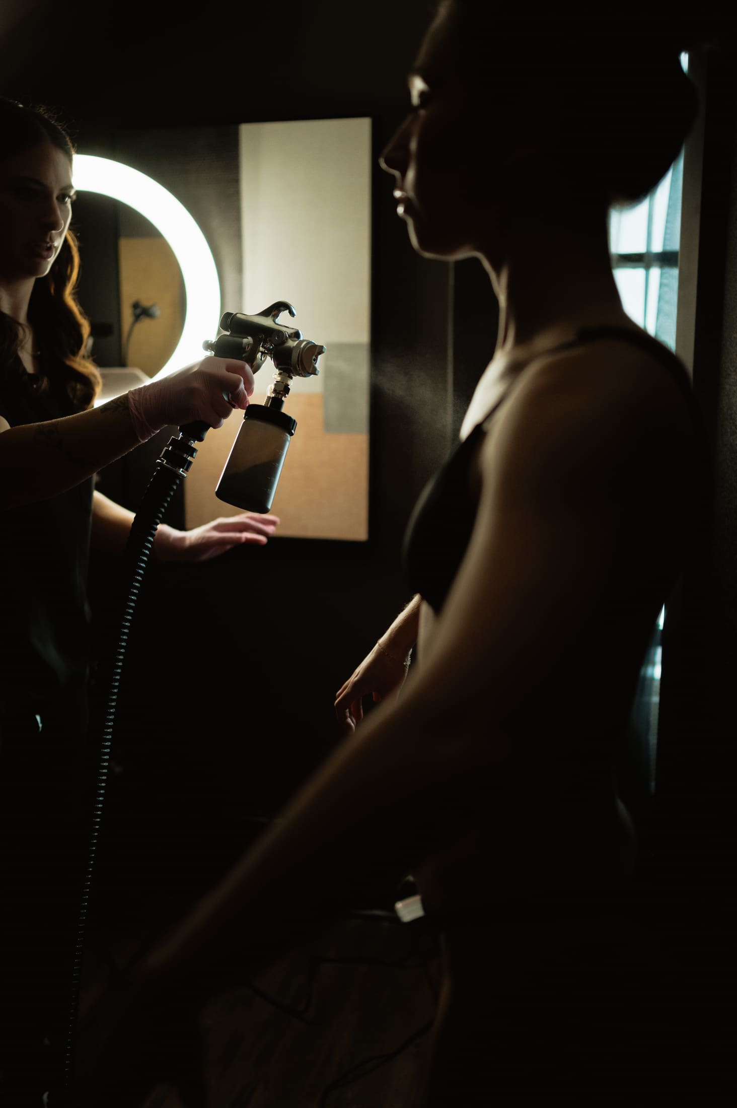 In-studio spray tan session in Knoxville