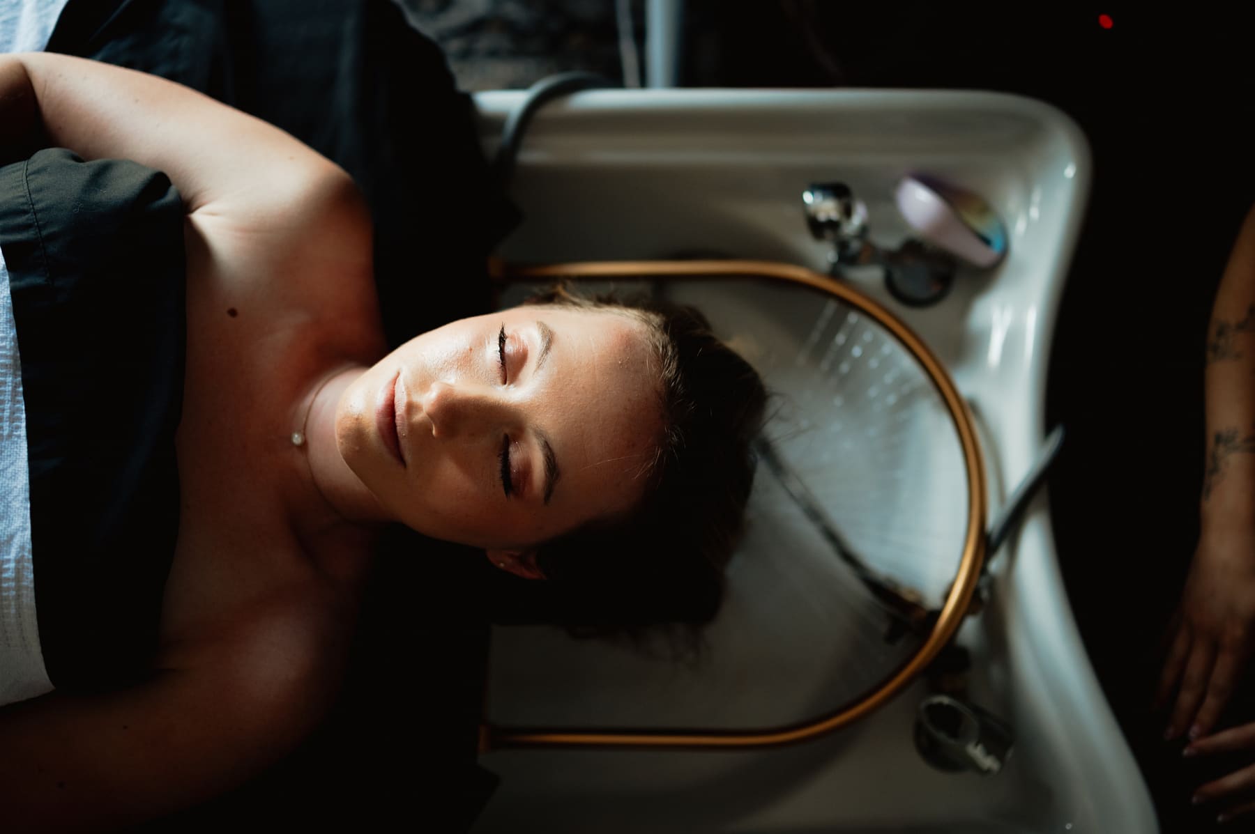 Guest receiving a restorative head spa treatment
